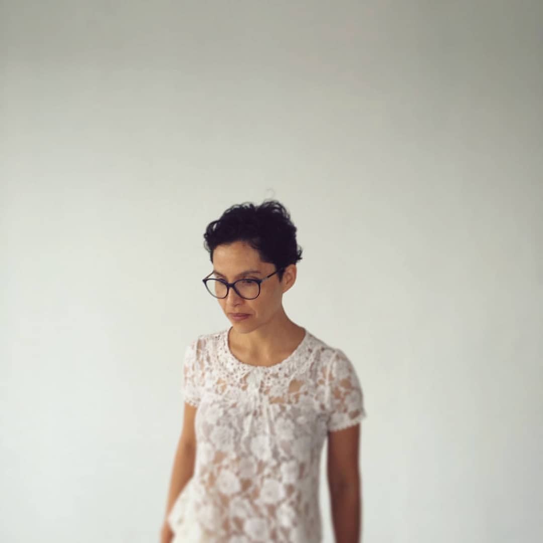 Photograph of Abigail Reyes against a white backdrop.