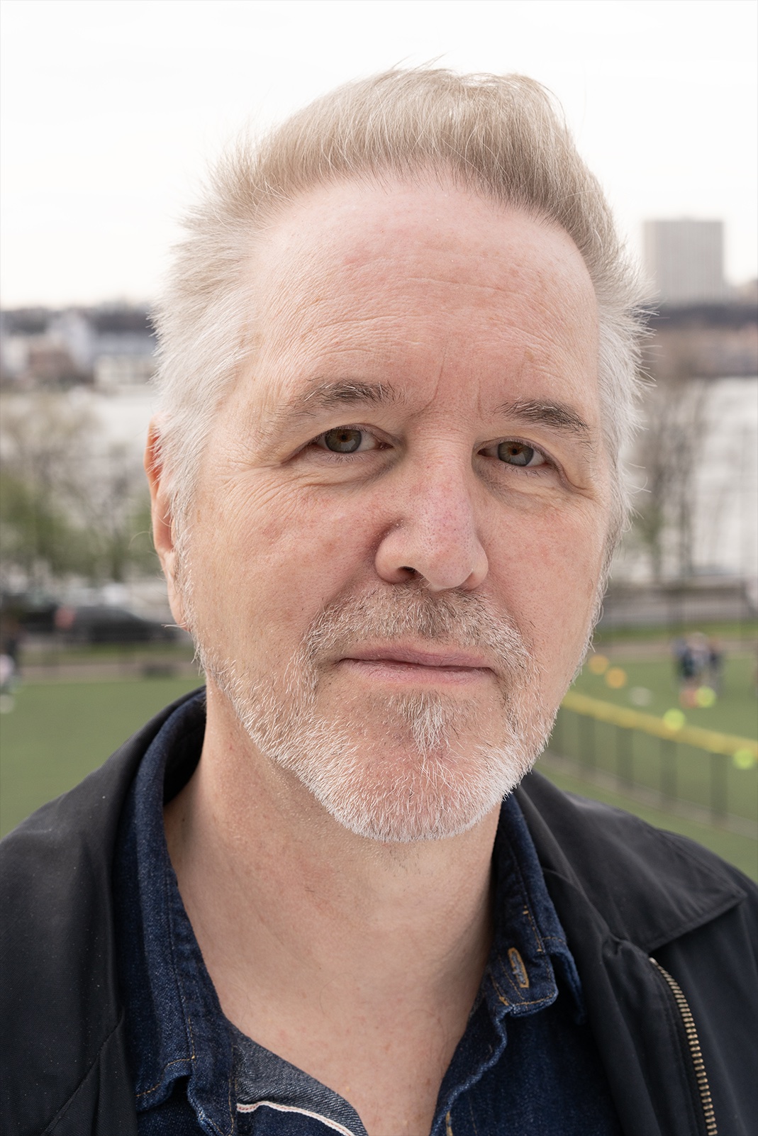 A picture of Frank Rubino outdoors, looking thoughtfully at the camera.