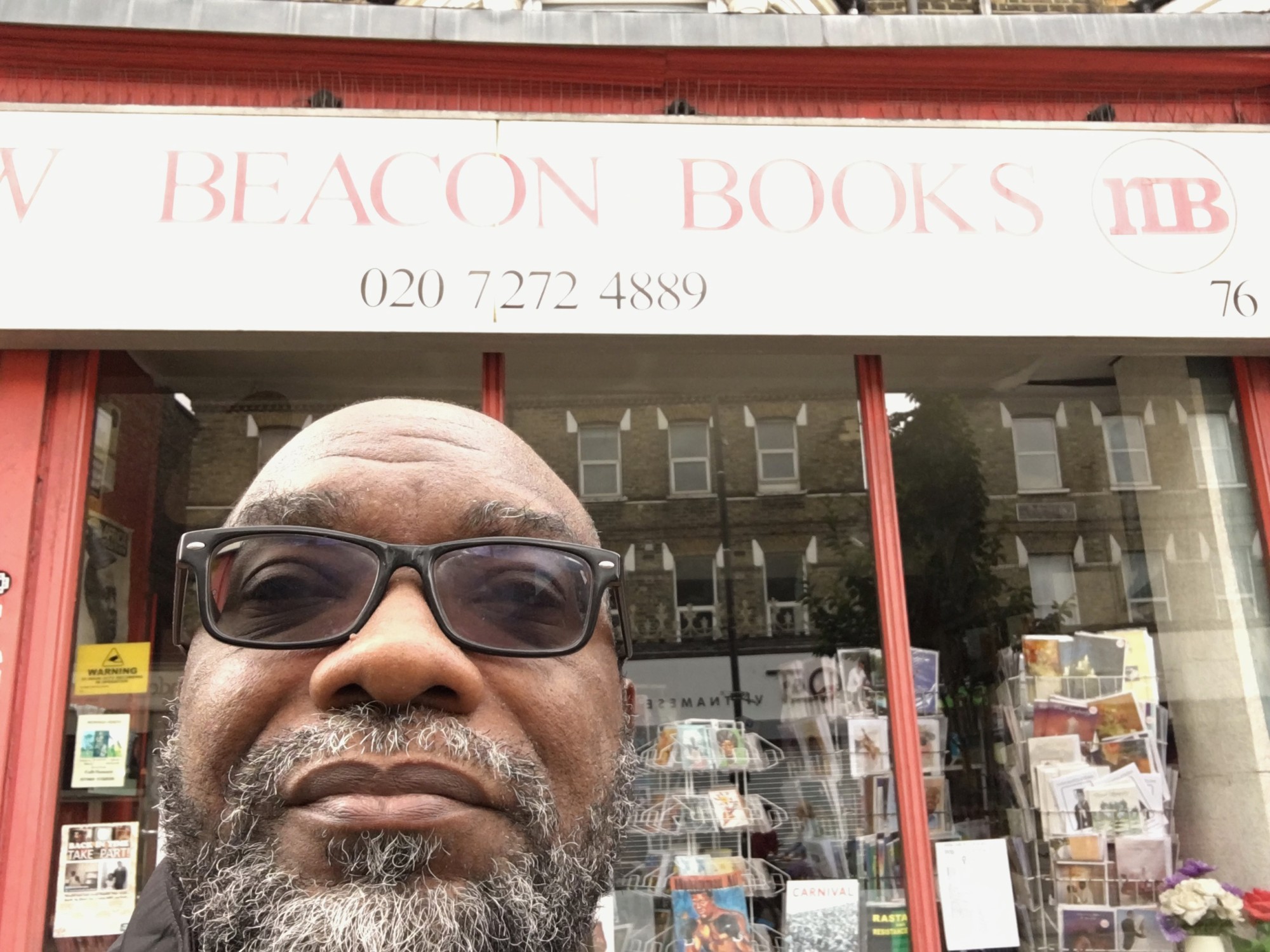 Fred Moten standing in front of New Beacon Books in London.