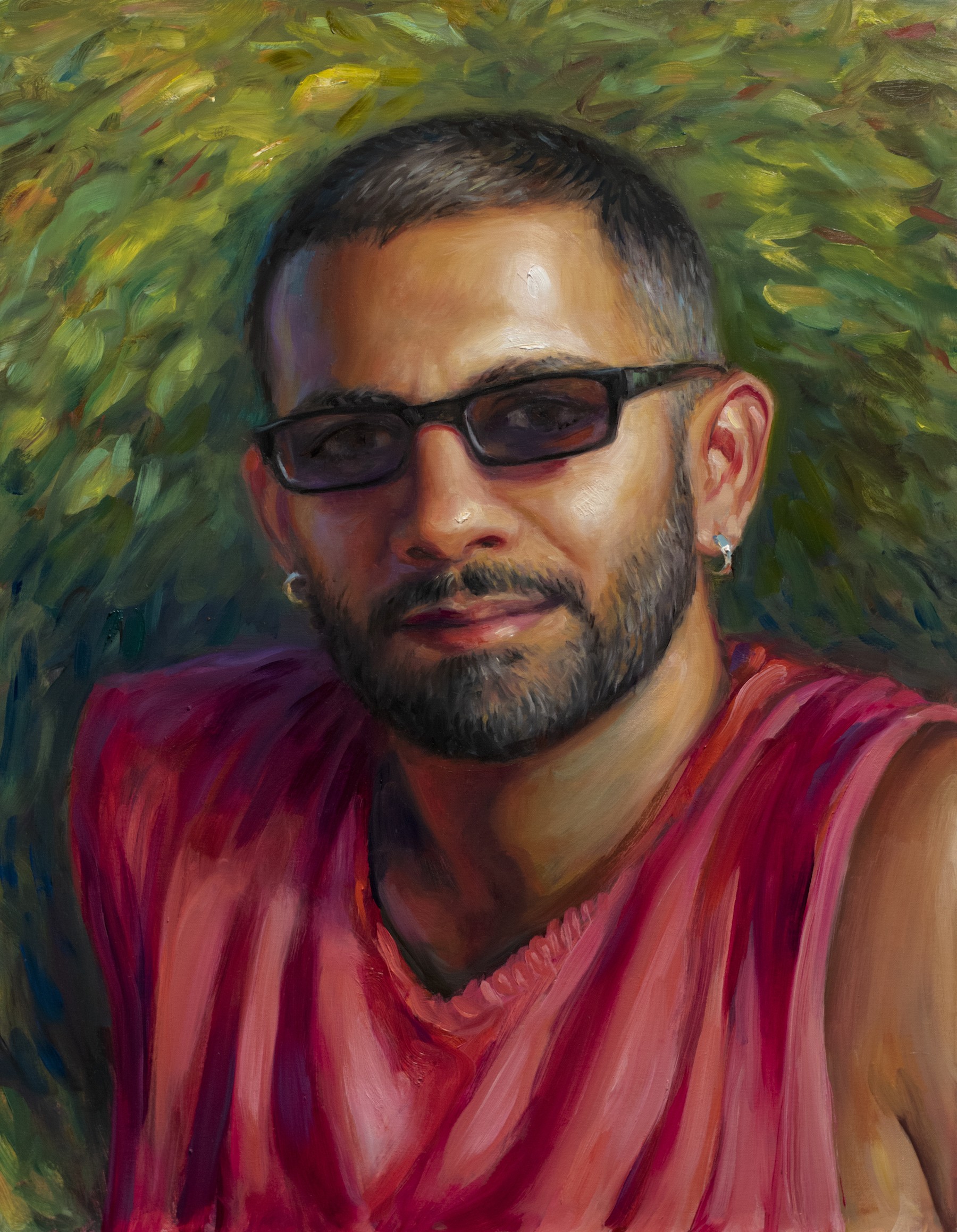 an oil painting on canvas by the painter TM Davy depicts the writer Shiv Kotecha. The painting is cropped tightly to the shoulders and from the chest up. In the painting, Shiv is wearing a read sleeveless shirt, small silver hoops, and narrow rectangular black sunglasses. Behind is loose, gestural greenery in broad daubs of paint that radiate outward directionally.